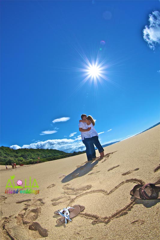 shoeas the heart the hug on th ebeach of Oahu